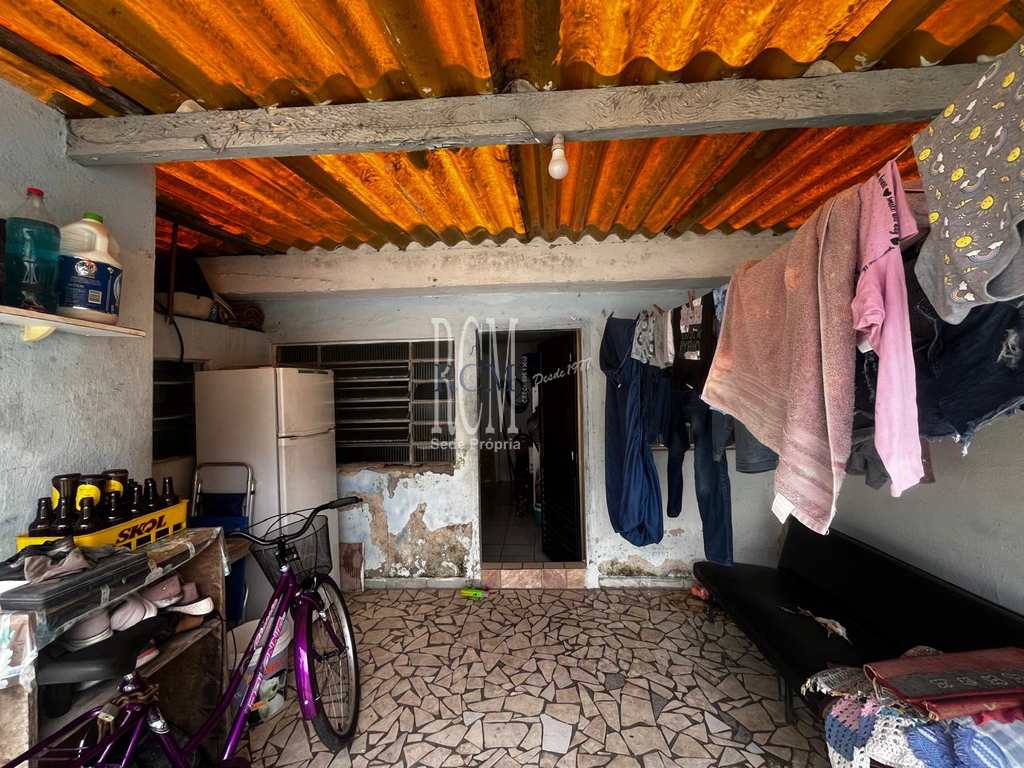 Casa em São Vicente, no bairro Vila Voturua