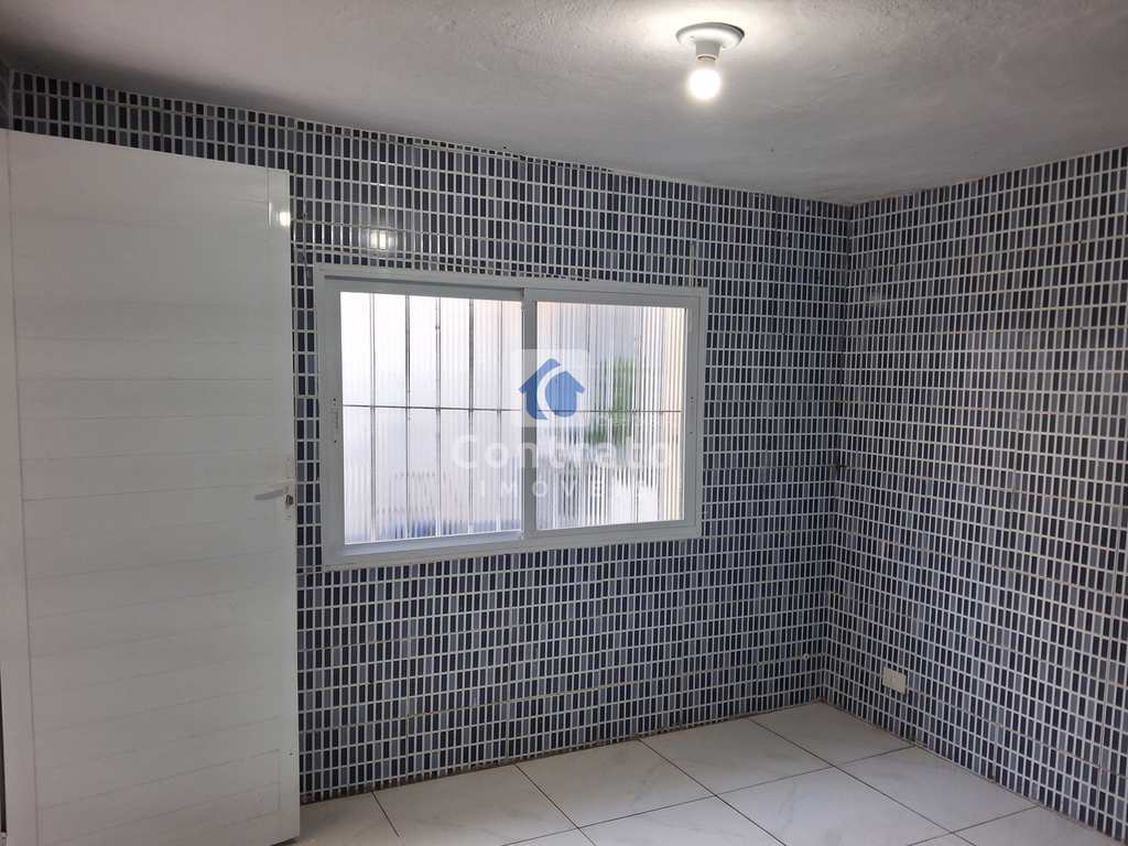 Casa em São Vicente, no bairro Vila Voturua